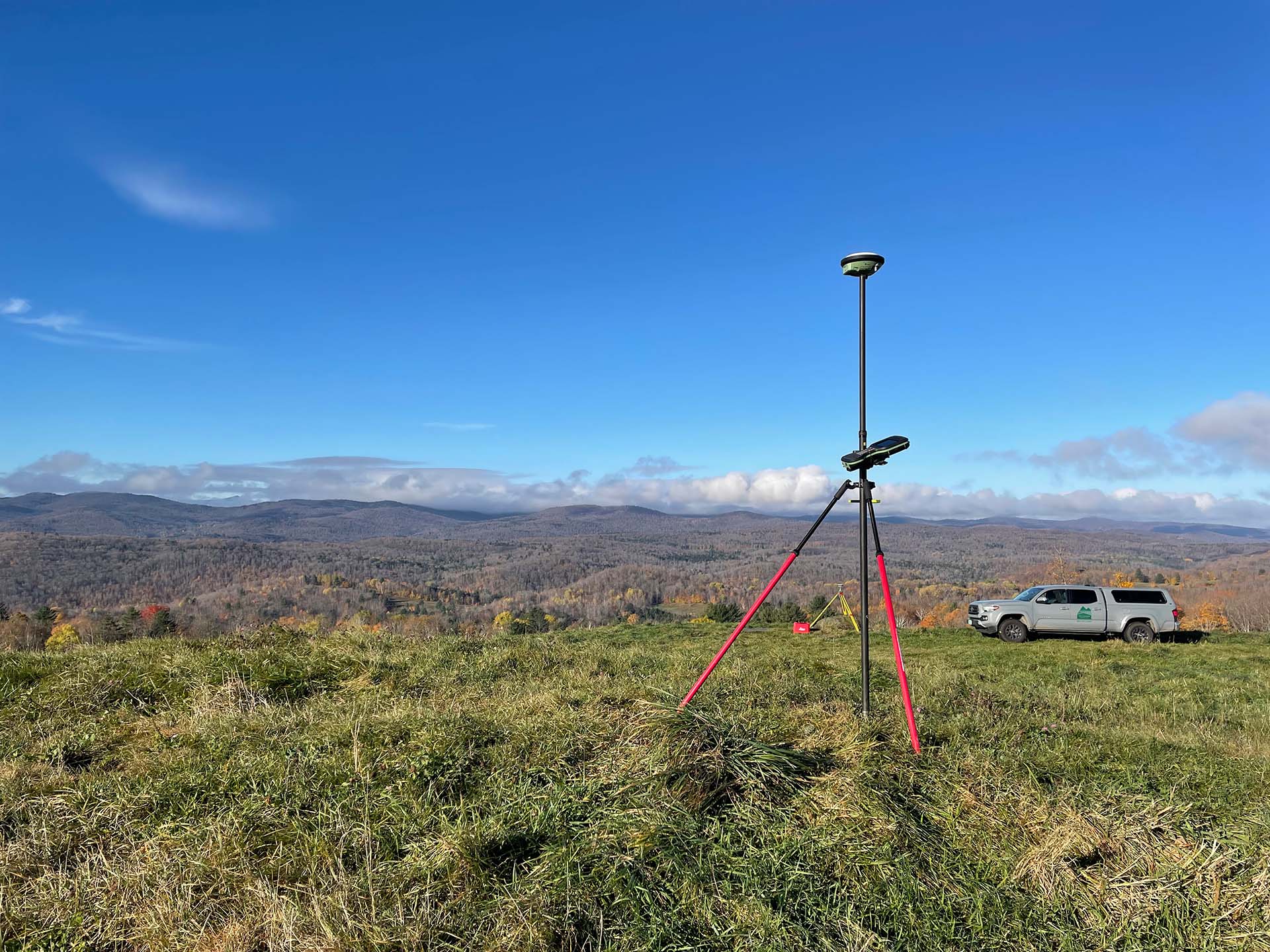 mountain view with truck and survey equipment